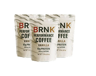 Three pouches of BRNK Performance Coffee, vanilla flavor.