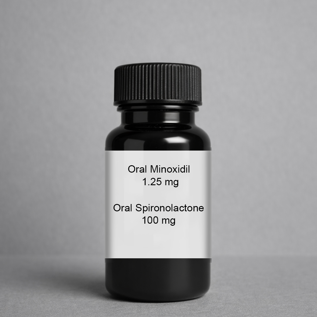 A black medicine bottle with a label for Oral Minoxidil 1.25 mg and Oral Spironolactone 100 mg.