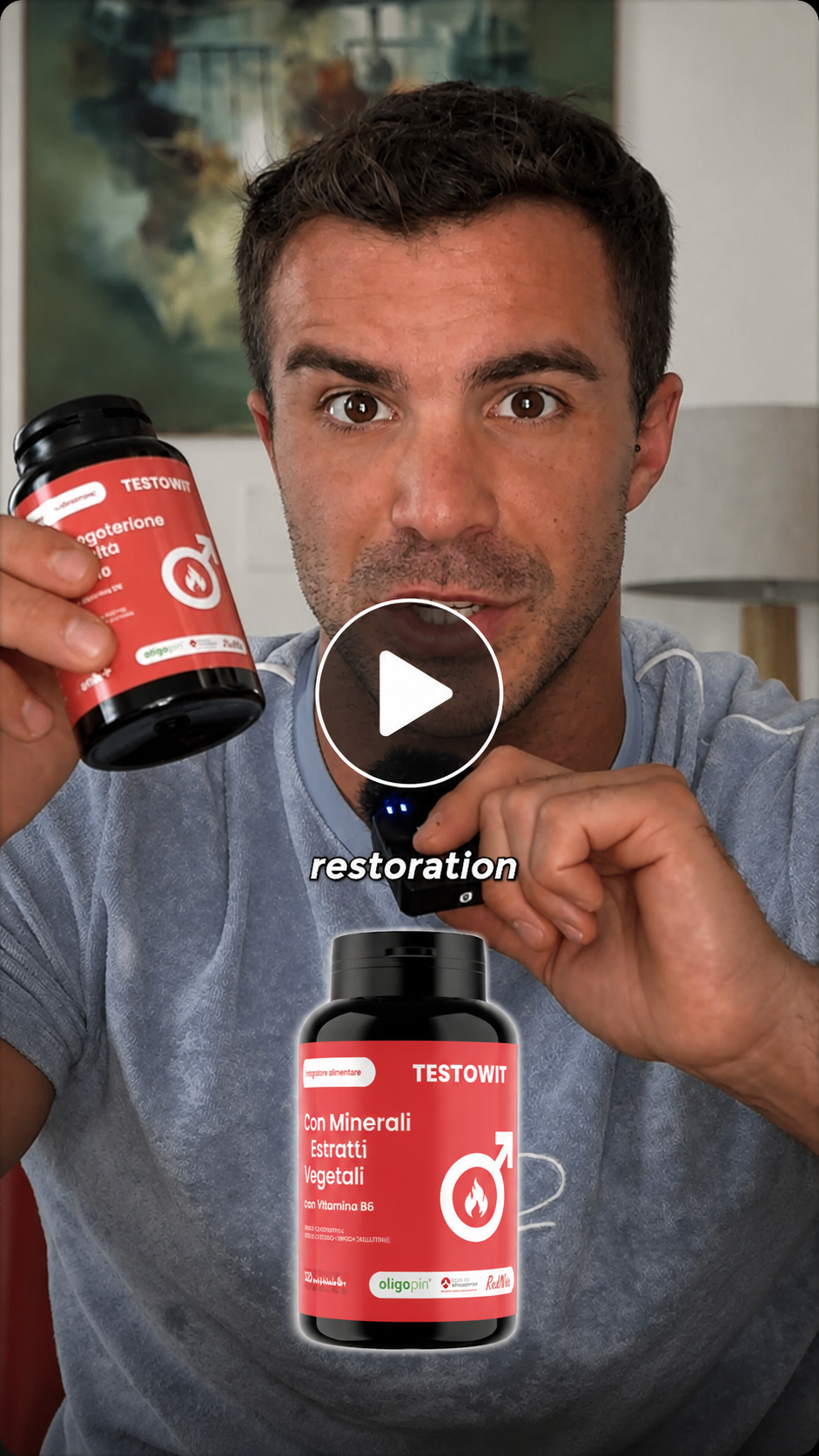 A man in a blue shirt holds up a bottle of Testowit supplements while speaking.