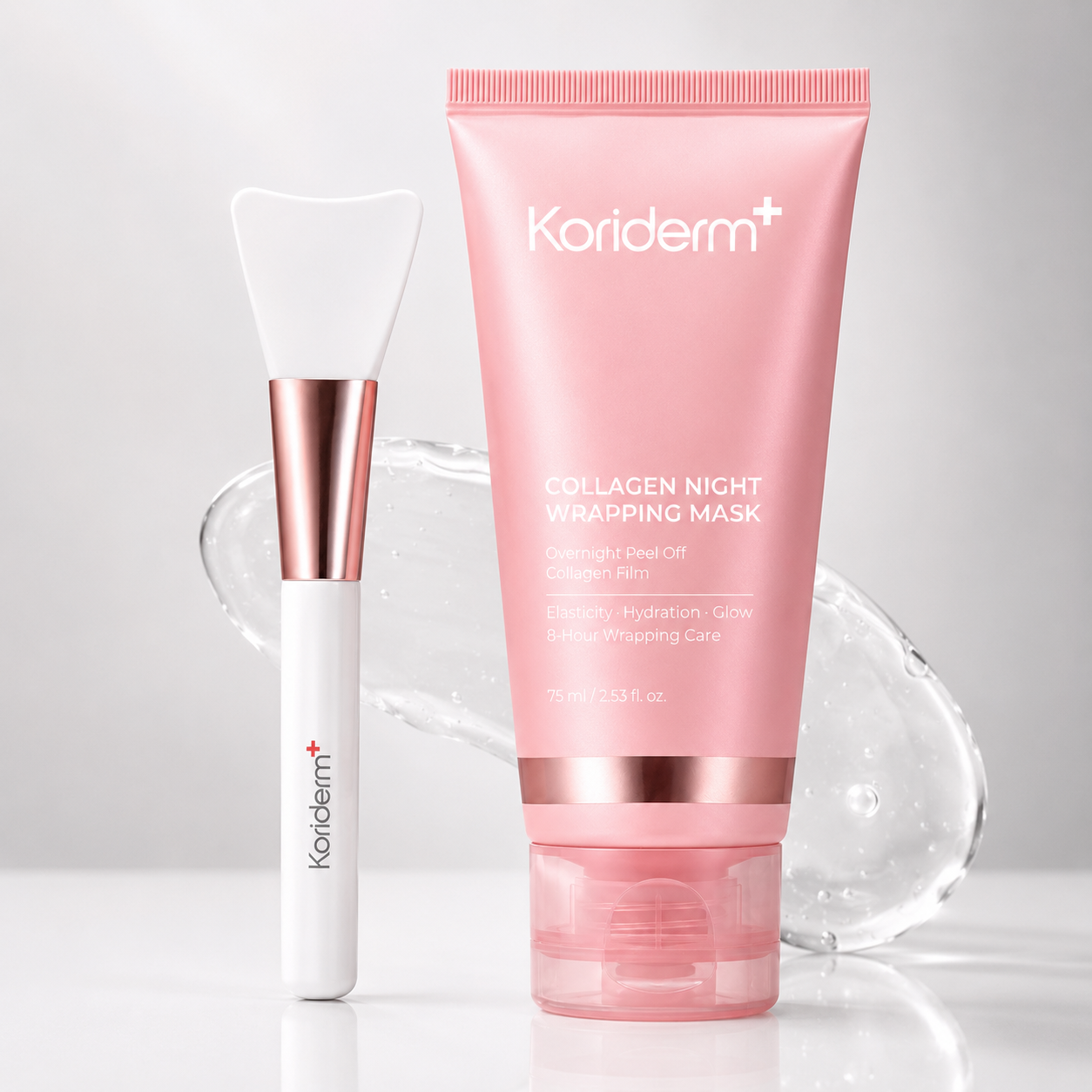 A pink tube of Koriderm+ Collagen Night Wrapping Mask next to a white and rose gold applicator brush.