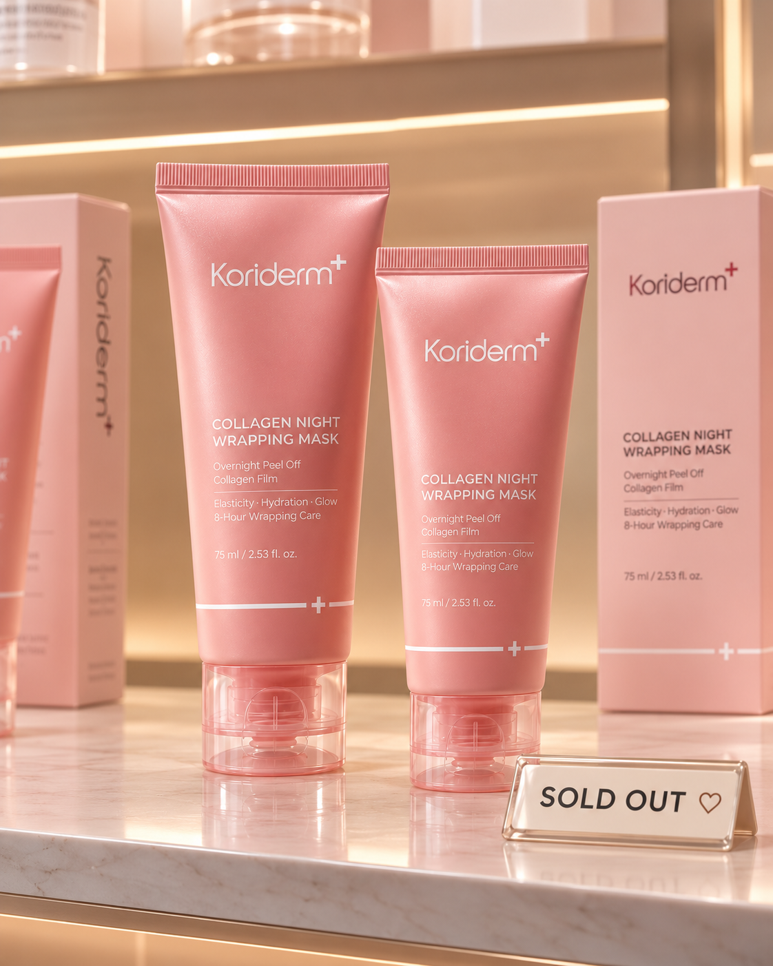 Two pink tubes of Koriderm+ Collagen Night Wrapping Mask on a marble counter with a 'Sold Out' sign.