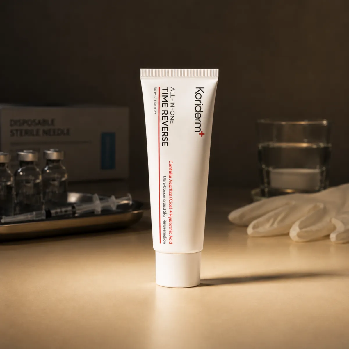 A tube of Koriderm cream on a table with medical supplies like needles, vials, and gloves.
