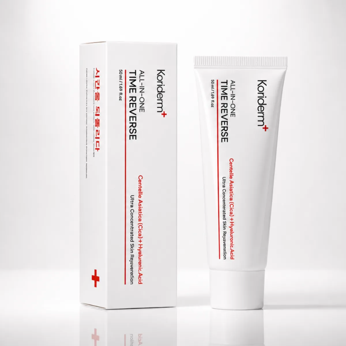 A white tube of Koriderm+ All-In-One Time Reverse skincare cream stands next to its matching white box.