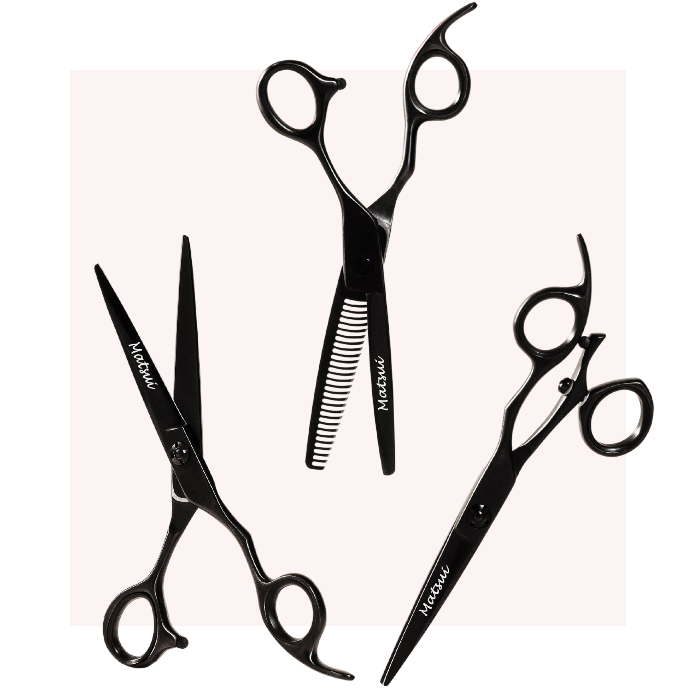 Three black hairdressing scissors on a light background.
