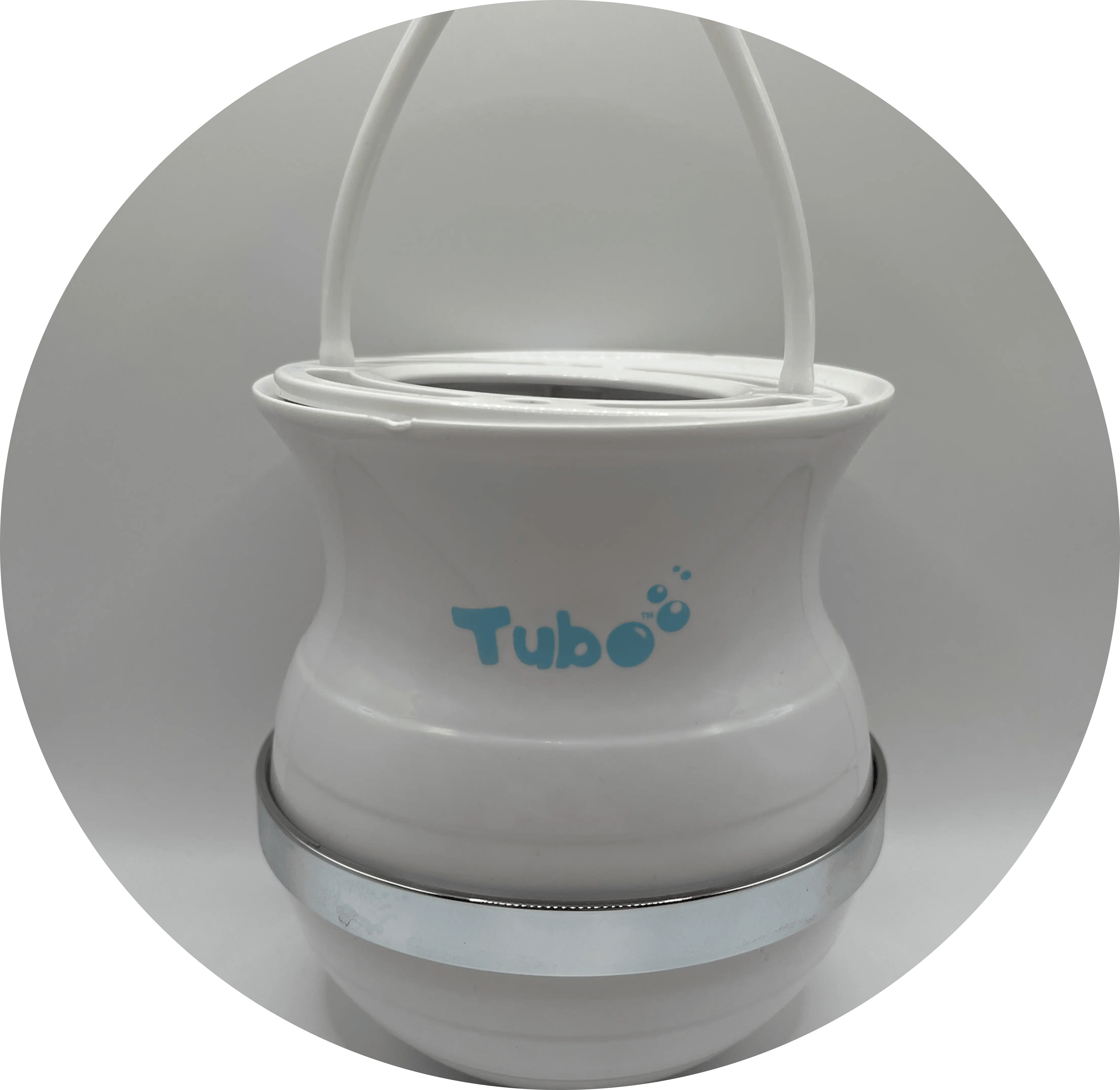 A smiling woman in a bathroom holds up a purple box of Tubo Primal Soap.
