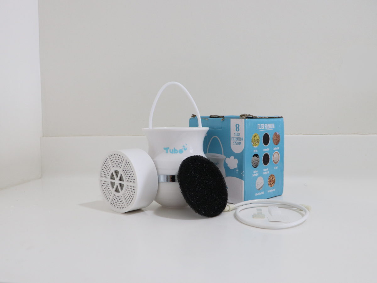 A Tube brand 8-stage filtration system with its components and packaging on a white surface.