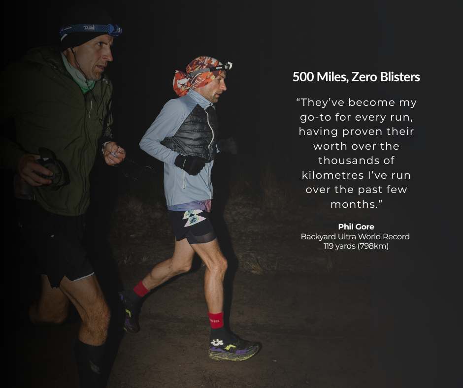 Two runners at night wearing headlamps, alongside motivational text about running 500 miles.