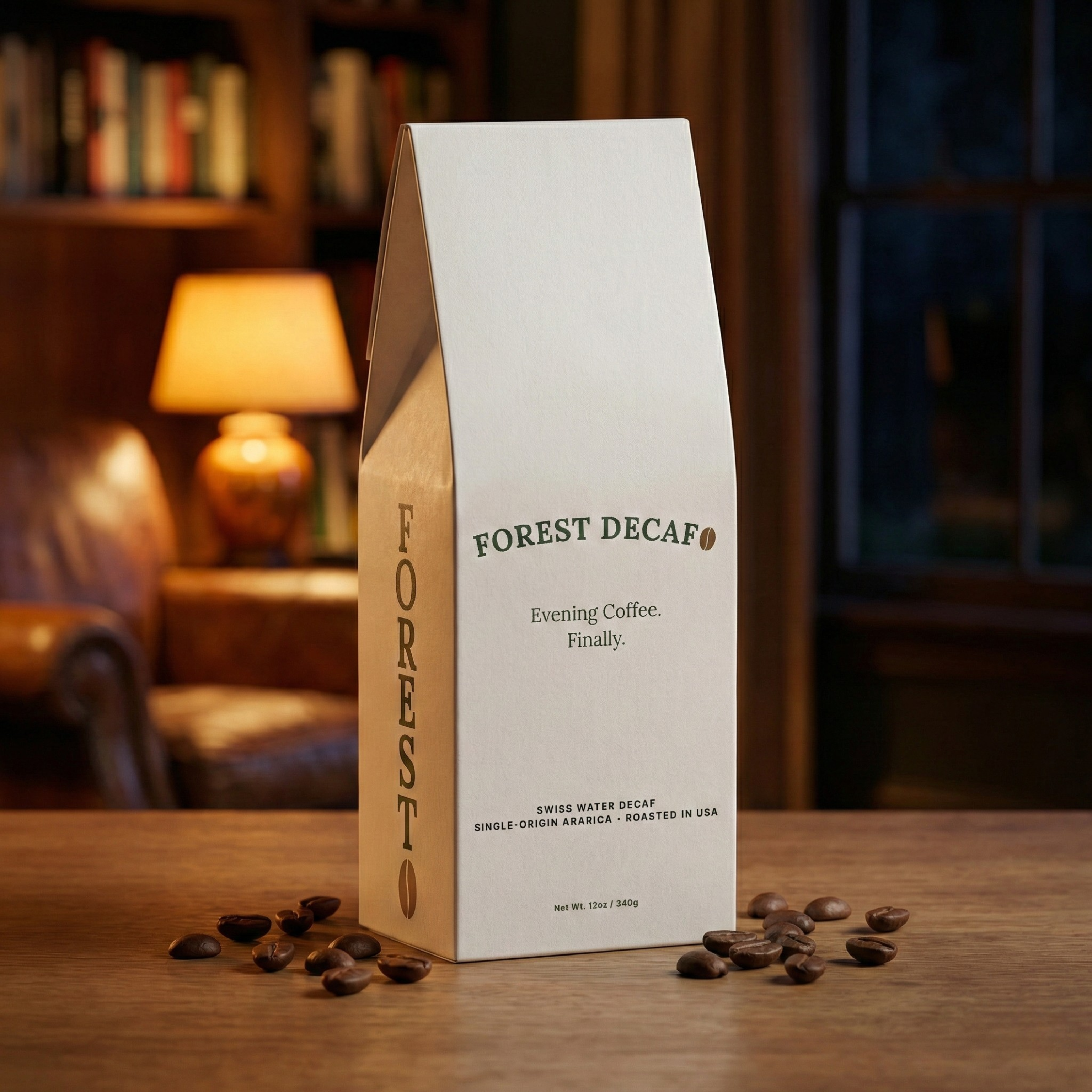 A white box of Forest Decaf coffee sits on a wooden table, surrounded by coffee beans.