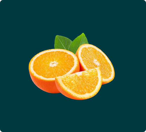 An orange cut into halves and a wedge, with a few green leaves, on a dark teal background.