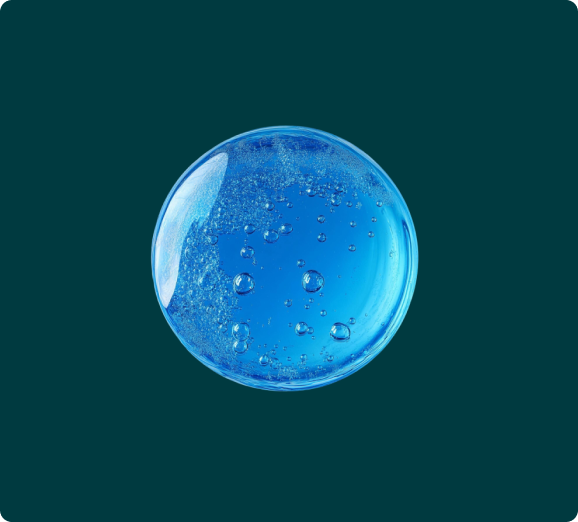 A round drop of clear blue gel with air bubbles inside on a dark green background.