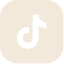 A white TikTok logo on a light beige, rounded square background.