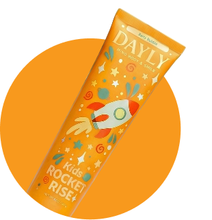 An orange tube of DAYLY Kids Rocket Rise toothpaste with a cartoon rocket ship design.