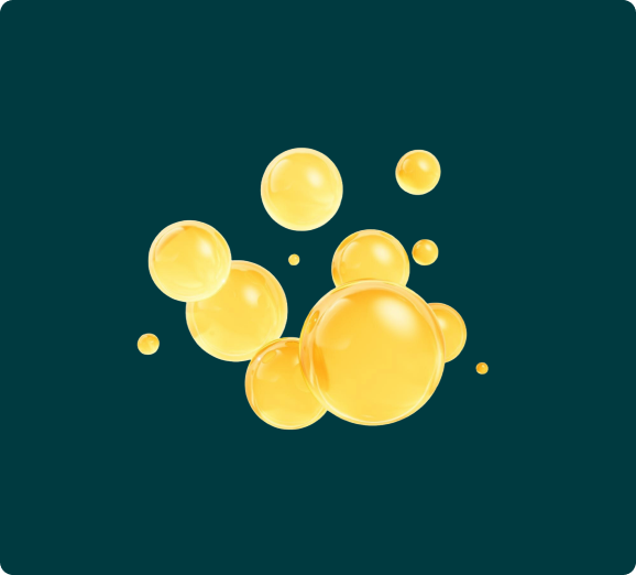A cluster of glossy, golden-yellow spheres of various sizes floating against a dark teal background.