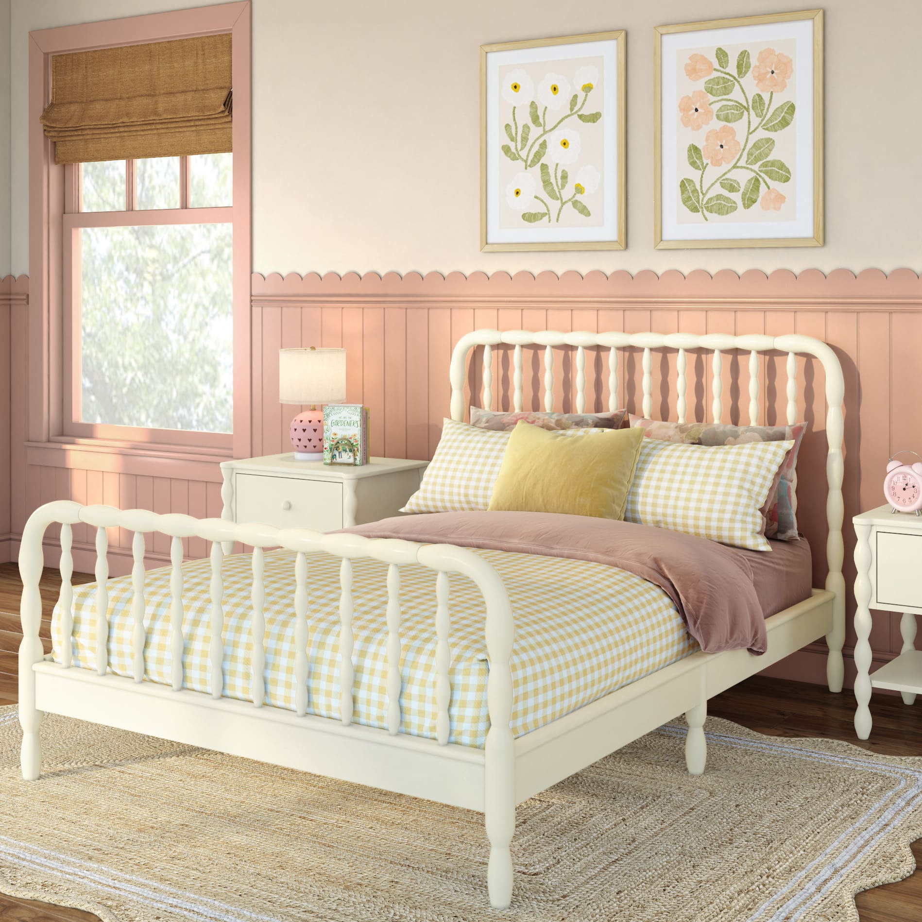 A white Jenny Lind style bed with pink and yellow plaid sheets in a pink and beige room. Matching nightstands are next to the bed.