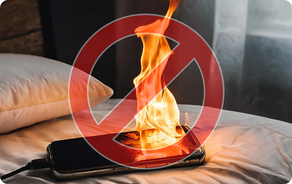 Smartphone on fire with a prohibition symbol overlay.