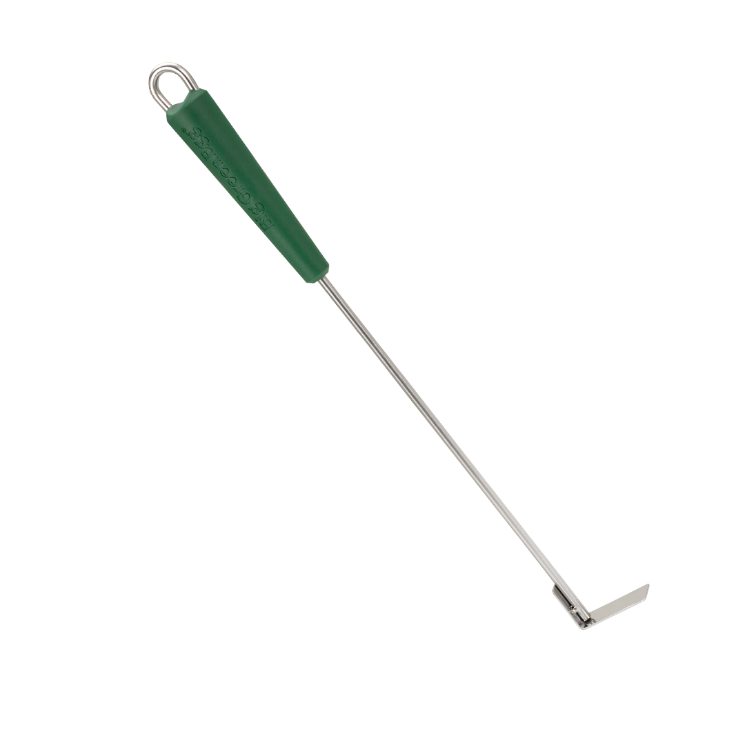 Long-handled metal tool with a green plastic grip and a flat end.