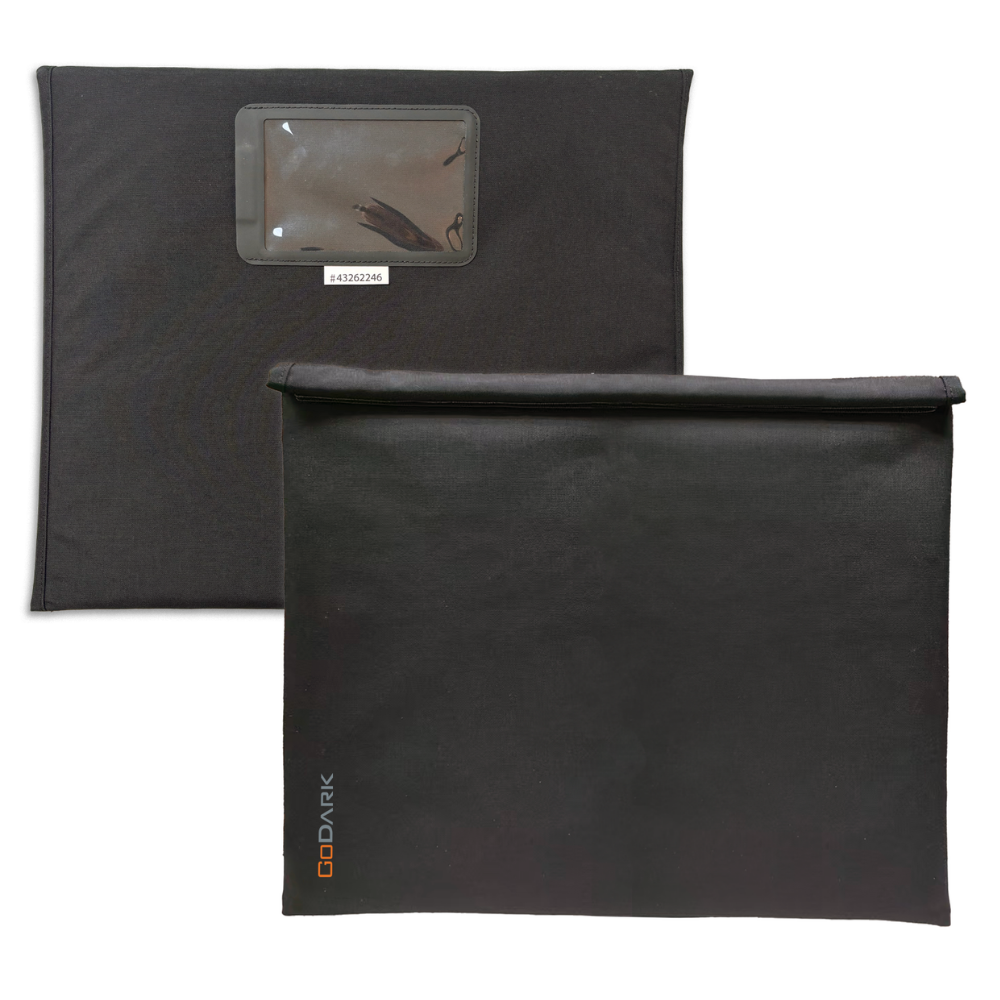 Two black GoDark fabric bags against a white background, one with a window, one with a rolled top.