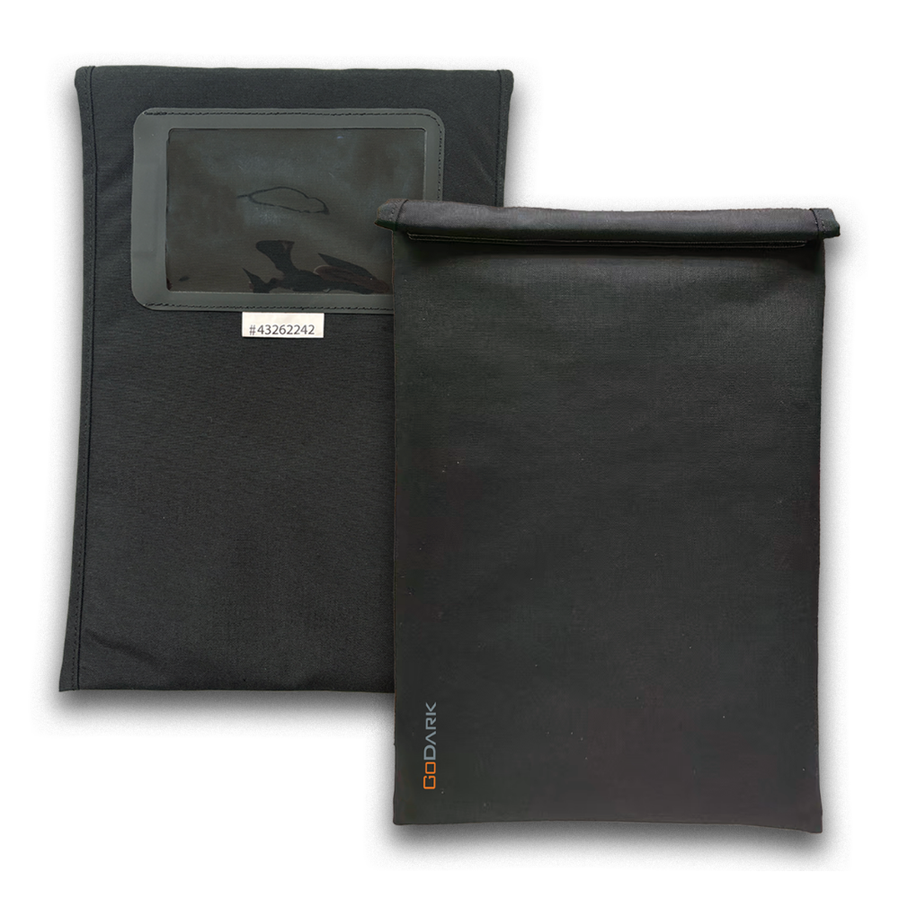 Two black GoDark fabric pouches, one with a clear window and the other with a roll-top closure.