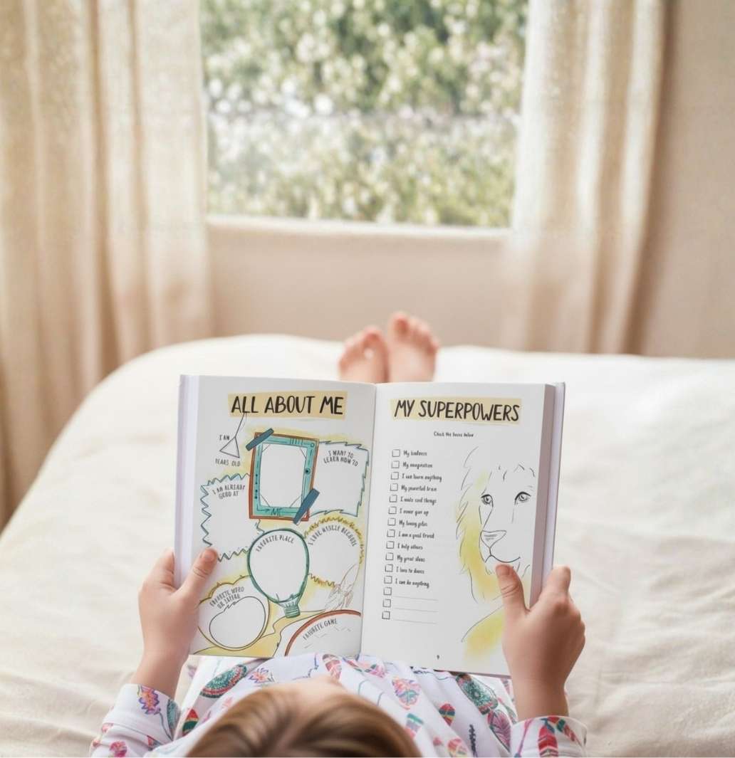 A child lying on a bed holds an open activity book titled 'My Superpowers'.