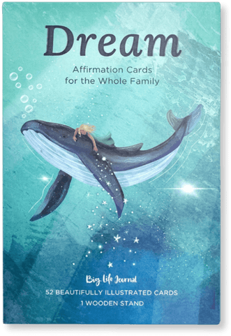 The box for Dream Affirmation Cards, featuring an illustration of a child riding on a whale.