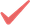A red checkmark icon with a slight blur effect on a white background.