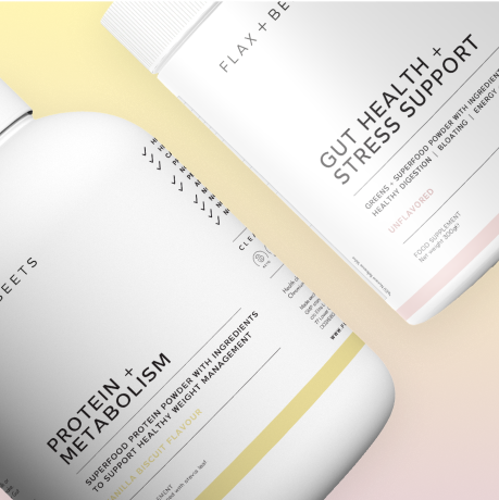 Two supplement containers labeled 'Protein + Metabolism' and 'Gut Health + Stress Support' on a gradient background.