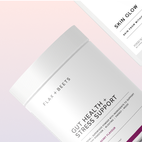 White container labeled 'Gut Health + Stress Support' on a gradient background.