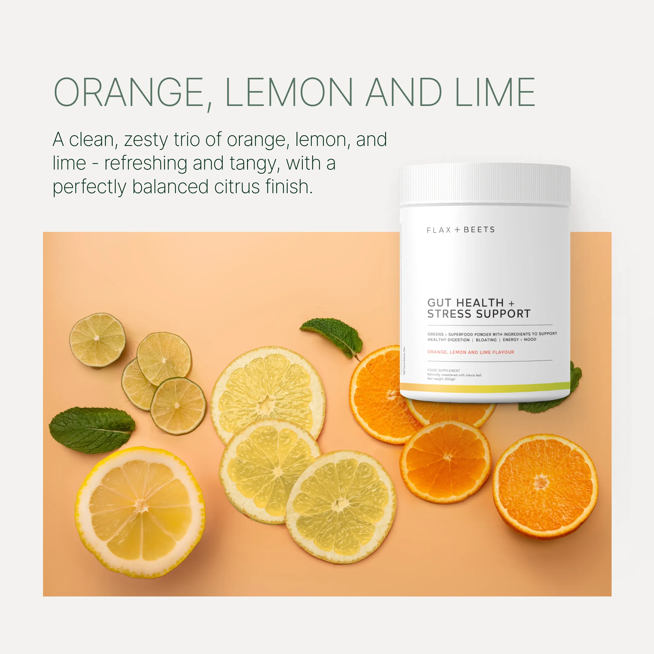 Two containers of gut health supplements with glasses of green juice and fruit slices.