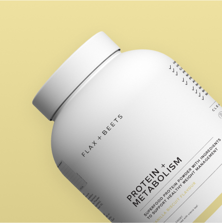 White protein powder container with 'Flax + Beets' label on a yellow background.