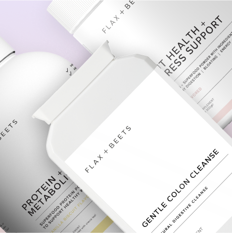 Three Flax + Beets supplement packages on a light background.