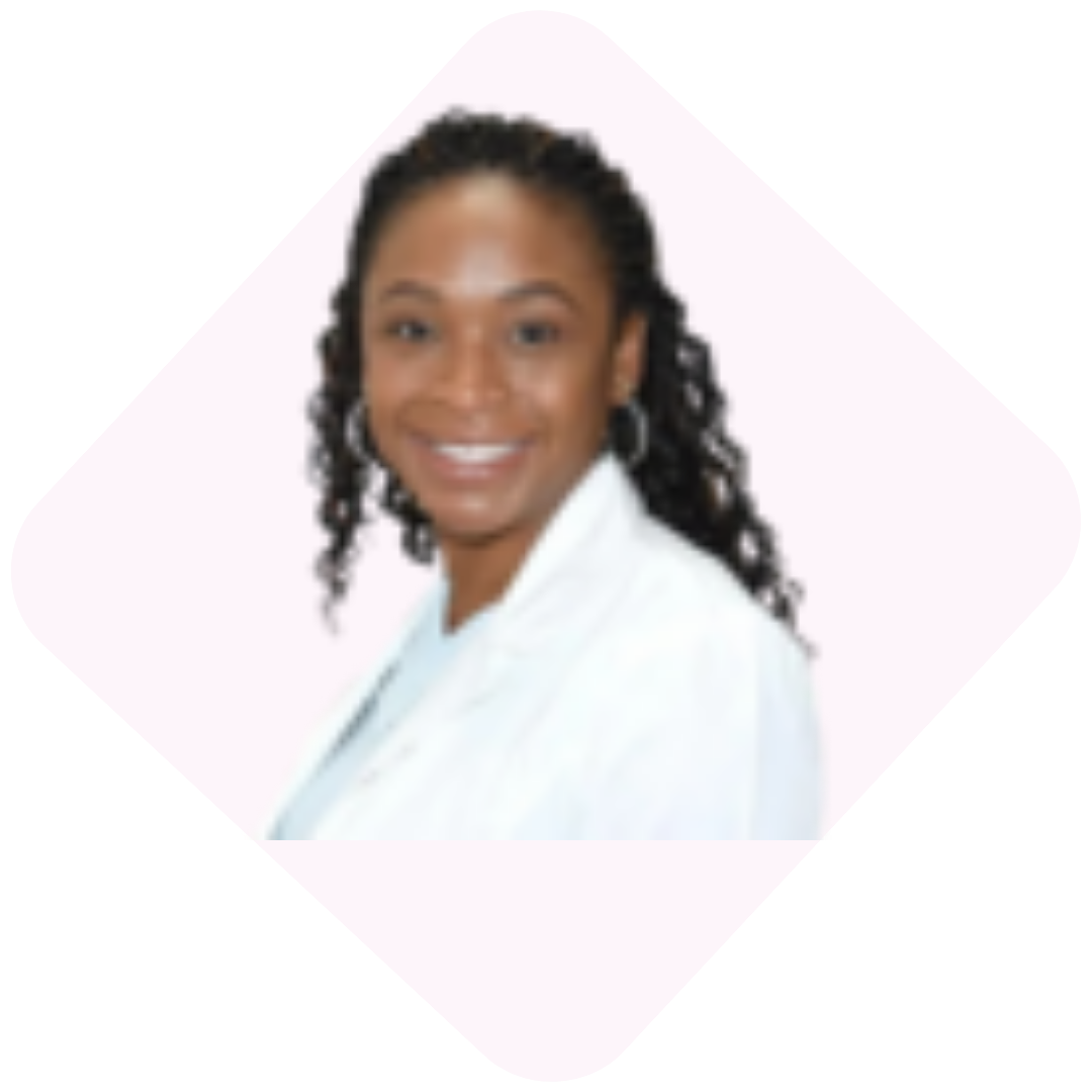 A smiling Black woman with long, dark hair wearing a white coat inside a diamond-shaped frame.