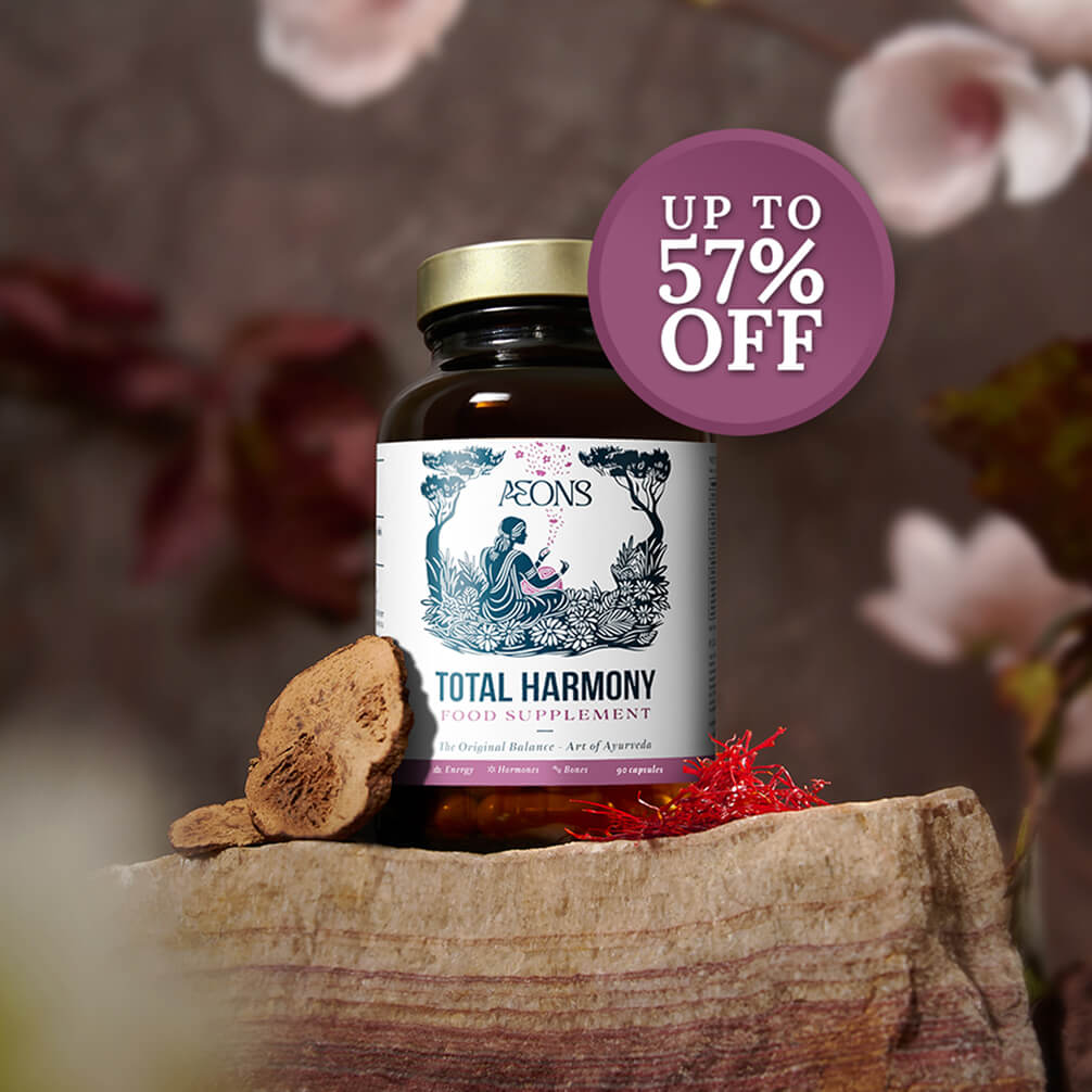 A bottle of Total Harmony food supplement rests on a rock with raw ingredients and a 57% off sticker.