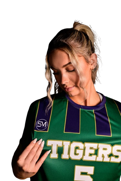 Person in a green sports jersey with 'TIGERS' text, looking down.