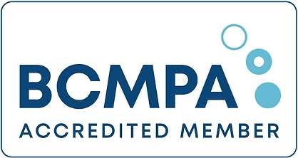 BCMPA Accredited Member logo with blue text and circles.