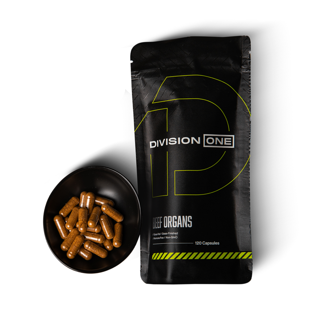 Black package labeled 'Division One' with capsules in a bowl.