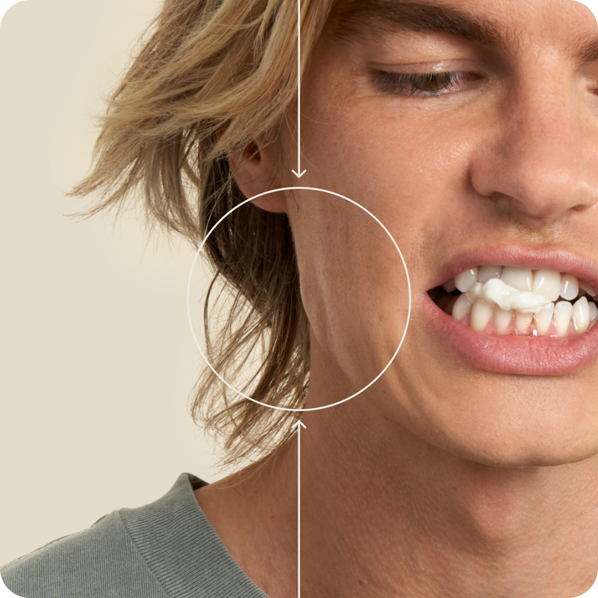 Close up of a man clenching his jaw with the masseter muscle highlighted
