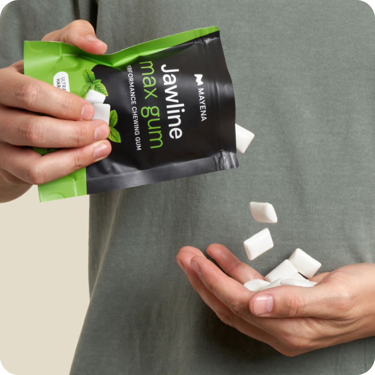 Pouring Mayena Jawline Max Gum from the pouch into a hand