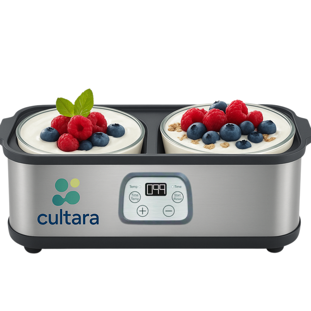 Yogurt maker with two bowls of yogurt topped with berries and mint.
