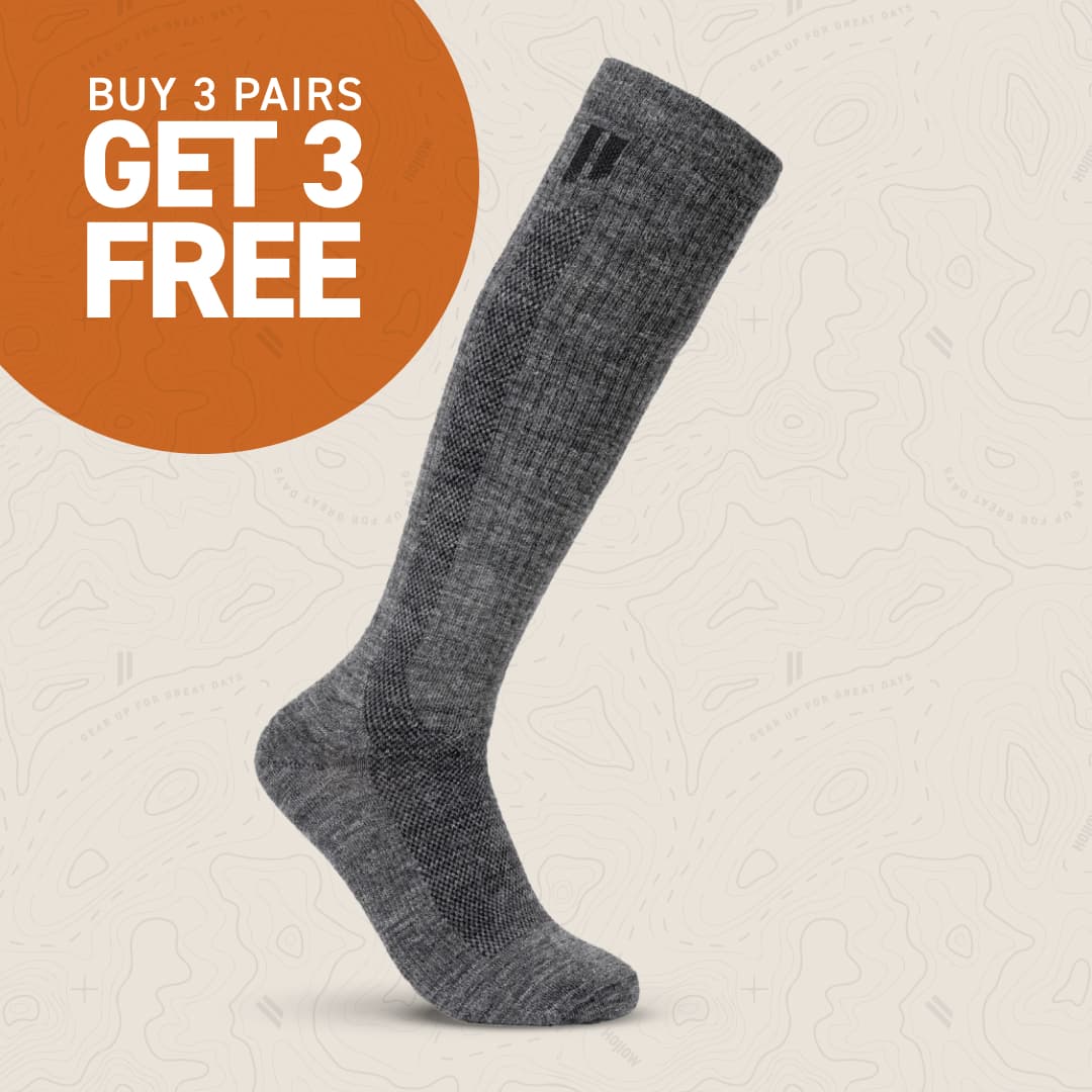 Gray sock with 'Buy 3 Pairs Get 3 Free' offer on orange circle.