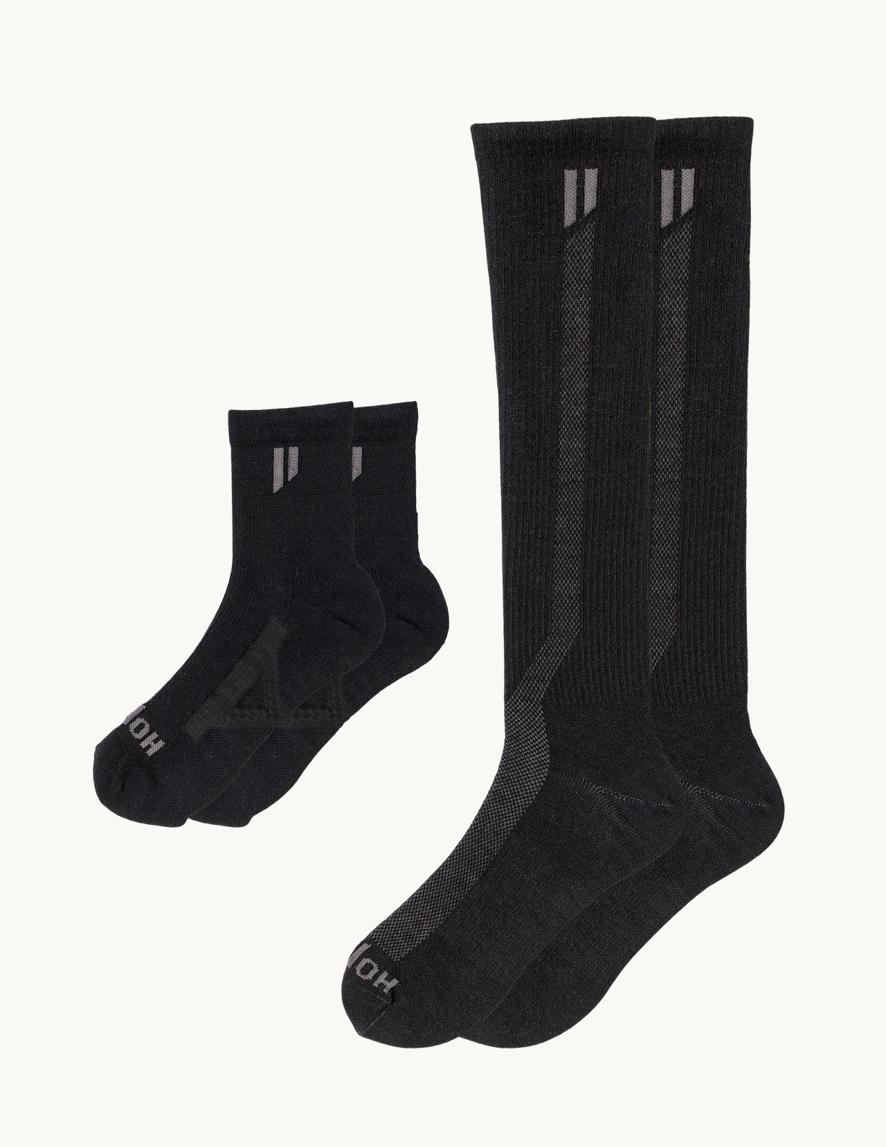 Two pairs of black athletic socks, one ankle-length and one knee-high, on a white background.