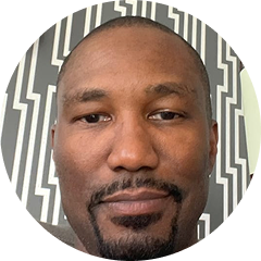 Portrait of a person with a patterned background.