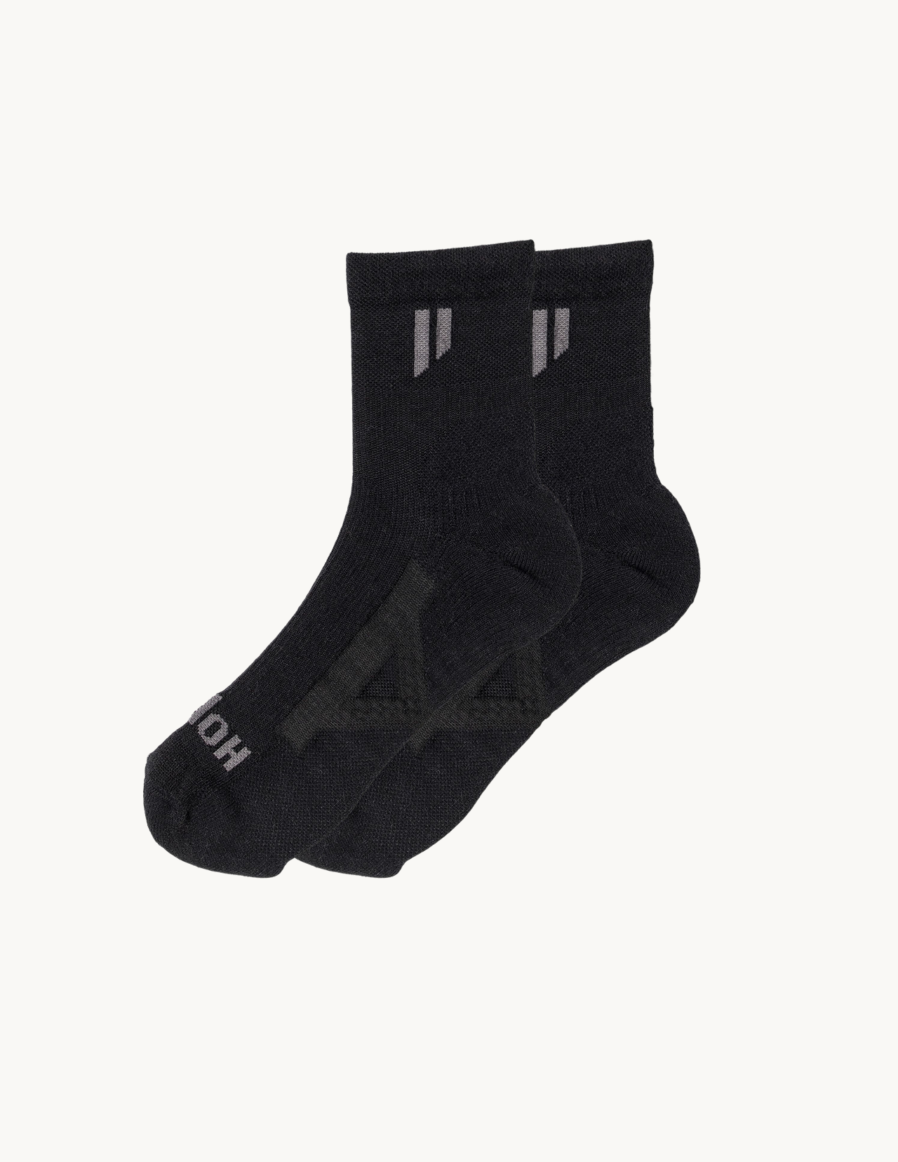 A pair of black ankle socks with grey logos against a plain white background.