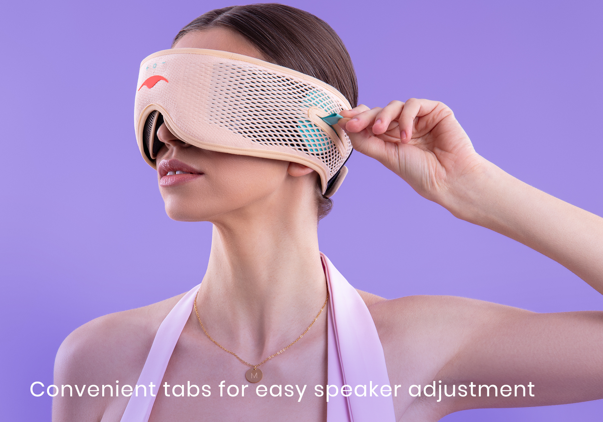 Person adjusting a VR headset with speaker tabs on a purple background.