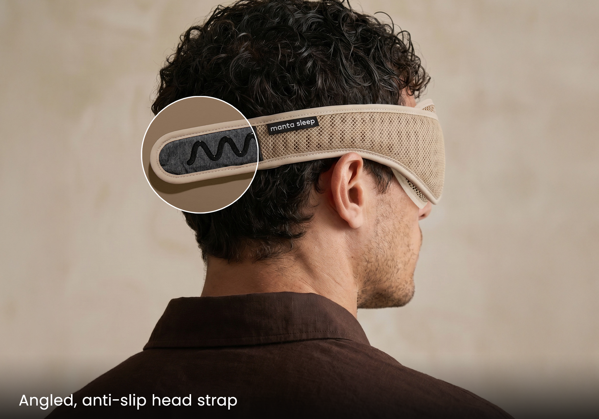 Back view of a man wearing a Manta Sleep mask, with a callout showing the anti-slip head strap.