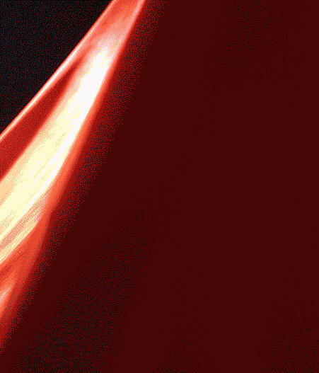 Close-up of a red fabric with a bright light reflection.