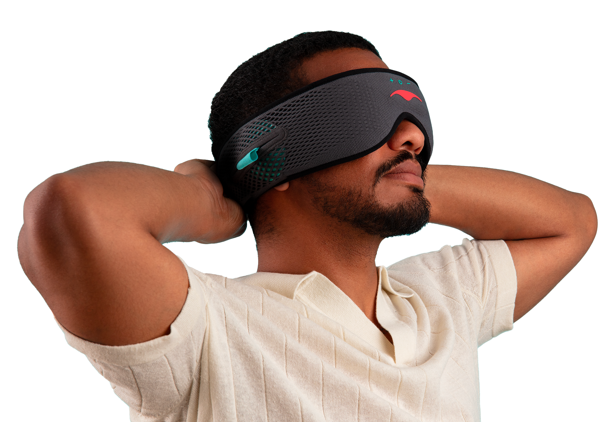 Person wearing a black eye mask, hands behind head, against a turquoise background.