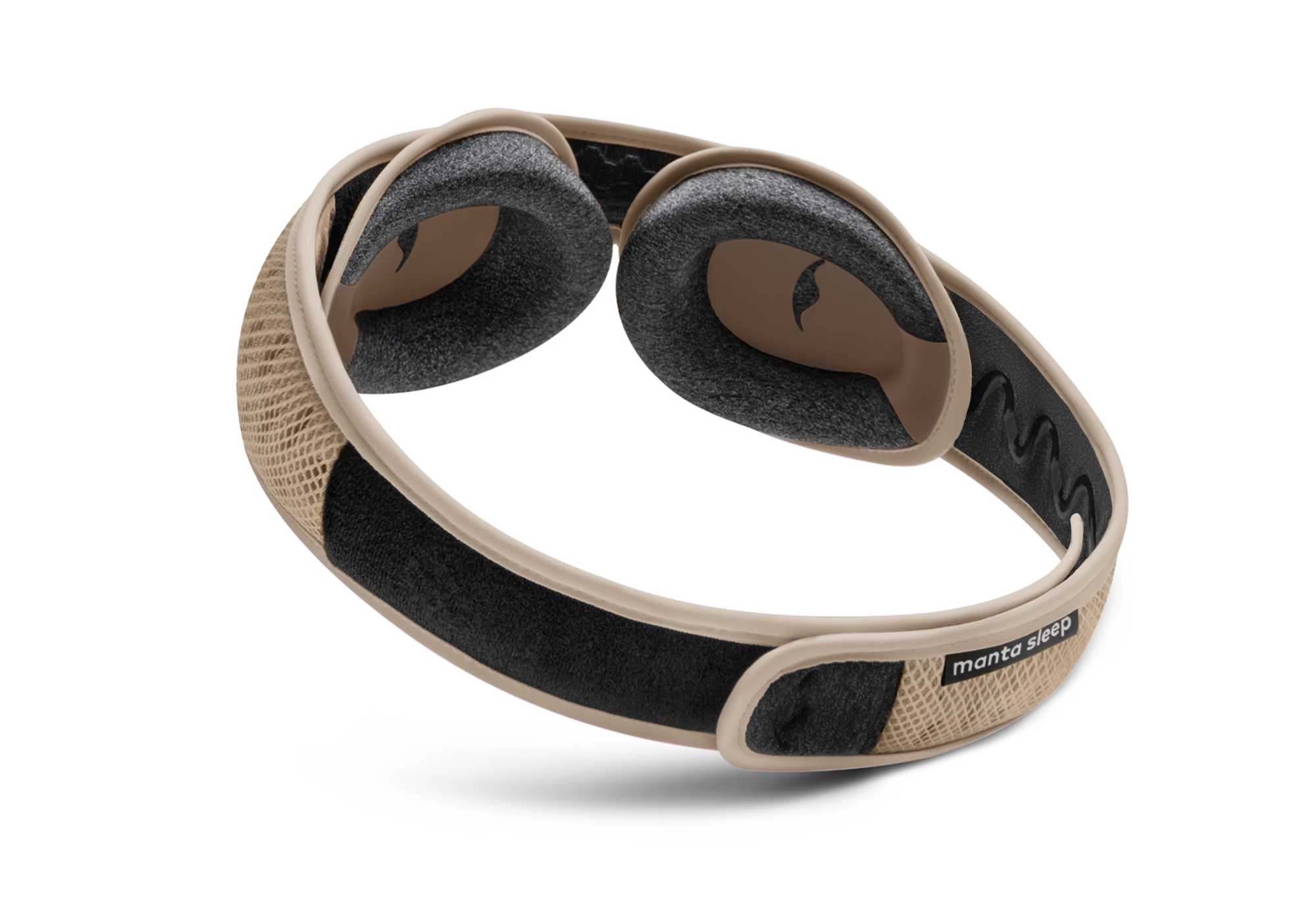 A tan and black Manta Sleep mask with contoured eye cups and a mesh strap against a white background.