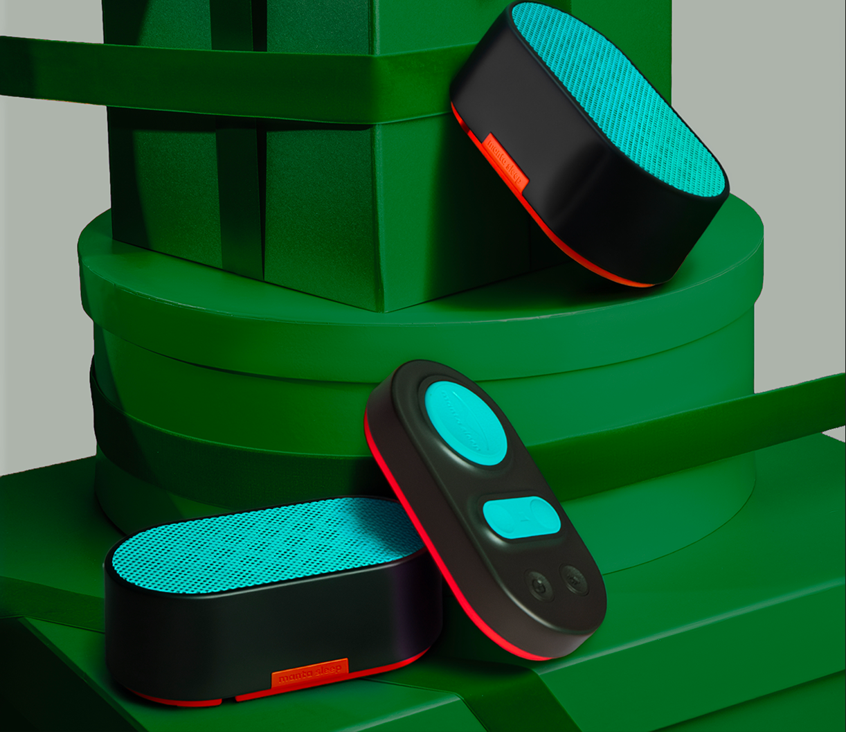 Black and blue devices on layered green circular platform.