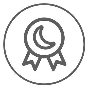 Circular emblem with a crescent moon and ribbons inside.