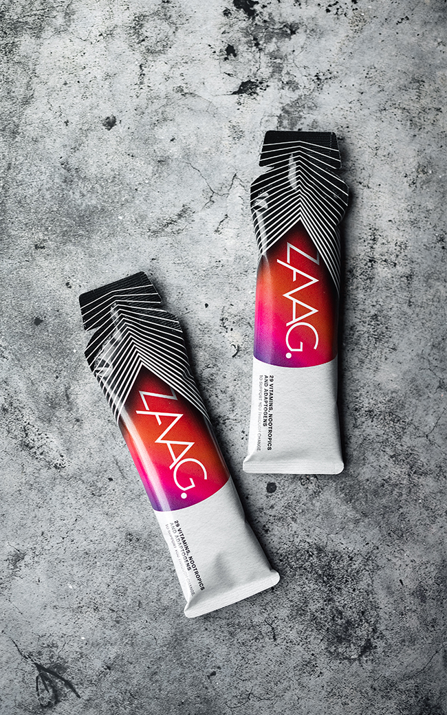Two packaged snack bars on a textured concrete surface.
